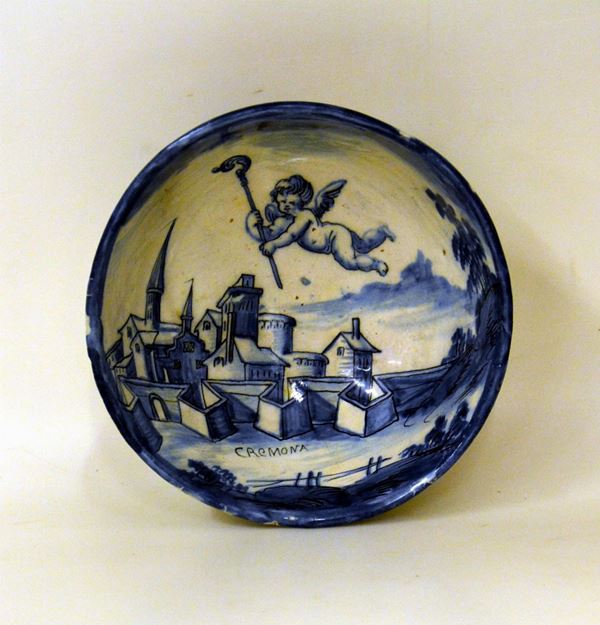 Ciotola, liguria, sec. XX, in maiolica nei toni del blu, decorata a paesaggio, cm 21x8, difetti