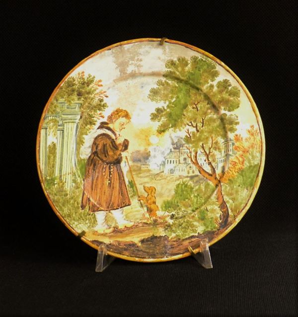 Piatto, Castelli, sec. XVII, in maiolica dipinta a