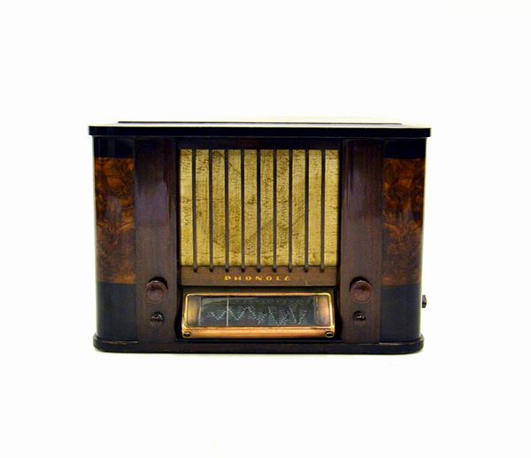 Radio Phonola, anni 30, modello 931, cassa in radica, cm 53,5x26,35&nbsp;&nbsp;&nbsp;&nbsp;&nbsp;&nbsp;&nbsp;  - Asta GIOIELLI, ARGENTI, E OPERE DI ARTE ANTICA E CONTEMPORANEA - Poggio Bracciolini Casa d'Aste