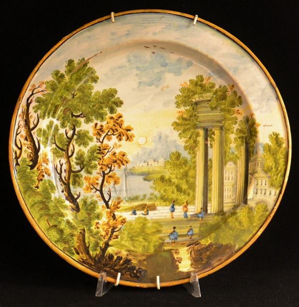 Piatto, Castelli, sec. XVII, in maiolica dipinta con&nbsp;&nbsp;&nbsp;&nbsp;&nbsp;&nbsp;&nbsp;&nbsp;&nbsp;&nbsp;&nbsp;&nbsp;&nbsp;&nbsp;&nbsp;&nbsp;&nbsp;&nbsp;&nbsp;&nbsp;&nbsp;&nbsp;