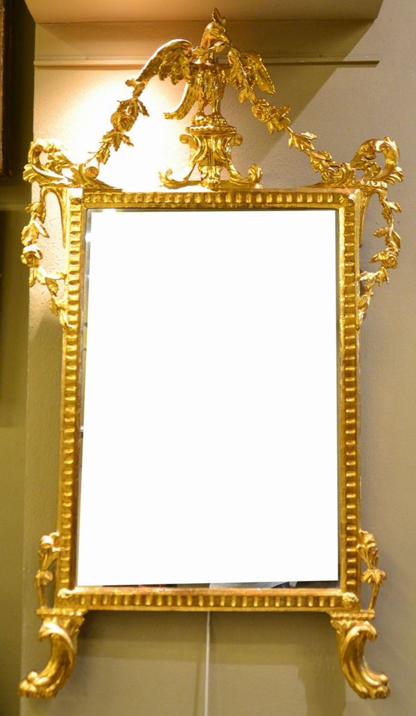 Specchiera, Luigi XVI, in legno dorato e intaglieto, finali e piedi felini,