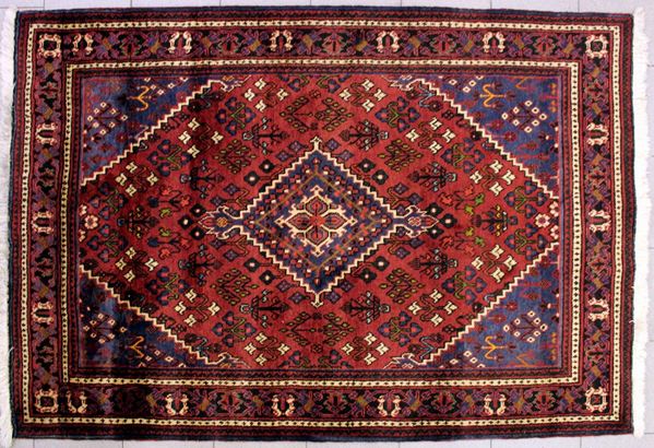 Tappeto manifattura nomade, sec. XX, impianto geometrico, campo neio toni&nbsp;