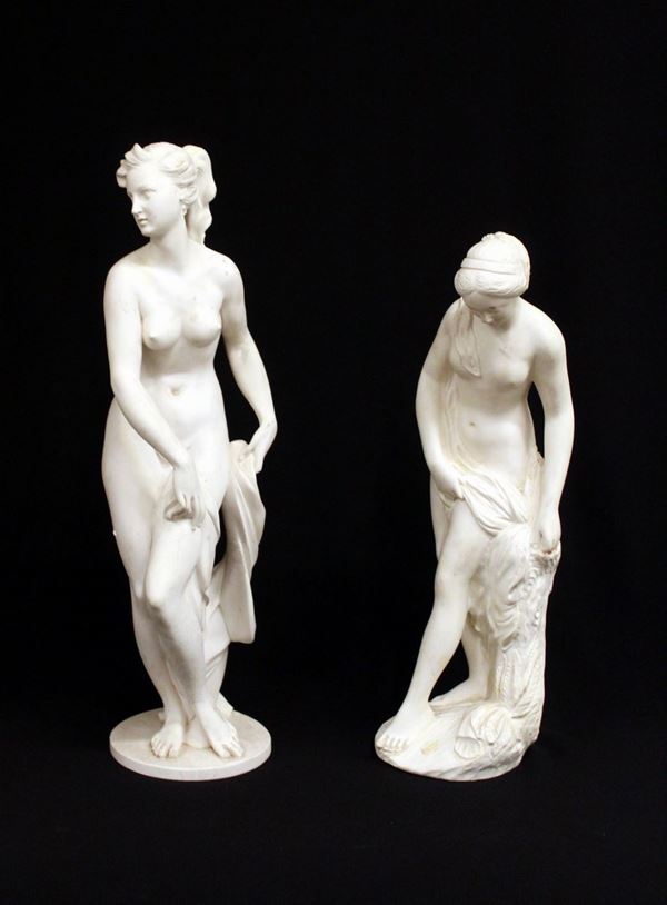 Due sculture, sec. XX, in resina caricata in polvere di marmo, raffiguranti