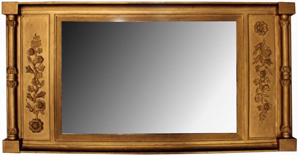Specchiera, sec. XX, in legno intagliato e dorato inquadrata da riserve a&nbsp;