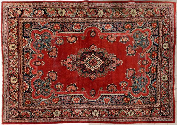 Tappeto persiano, sec. XX, impianto floreale, campo rosso centrato da&nbsp;&nbsp;&nbsp;&nbsp;&nbsp;