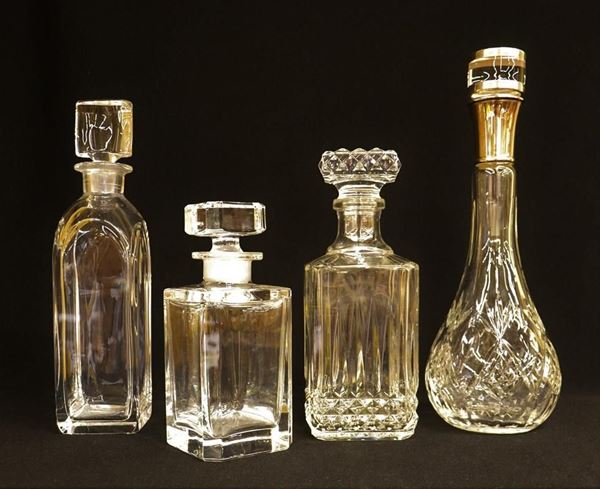 Quattro bottiglie da liquore, sec. XX, in cristallo,&nbsp;&nbsp;&nbsp;&nbsp;&nbsp;&nbsp;&nbsp;&nbsp;&nbsp;&nbsp;&nbsp;&nbsp;&nbsp;&nbsp;&nbsp;&nbsp;&nbsp;&nbsp;&nbsp;&nbsp;&nbsp;&nbsp;