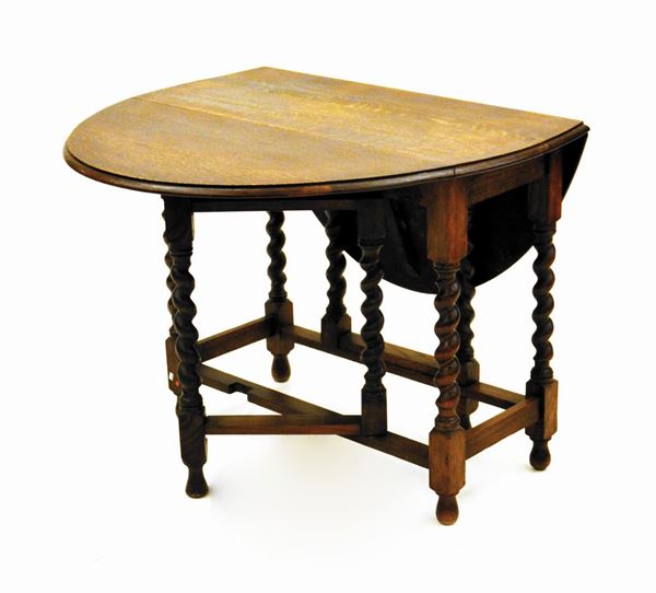 Tavolino, Inghilterra, sec. XX, in rovere, piano a bandelle, sostegni&nbsp;&nbsp;&nbsp;&nbsp;&nbsp;