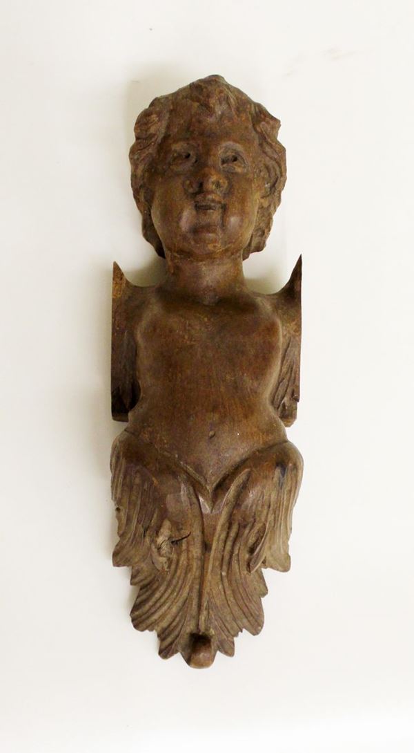 Cariatide, sec. XVIII, in noce scolpito a motivo busto di putto desinente 