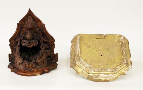 Mensola, fine sec. XIX, in legno intagliato a guisa di mascherone, alt. cm