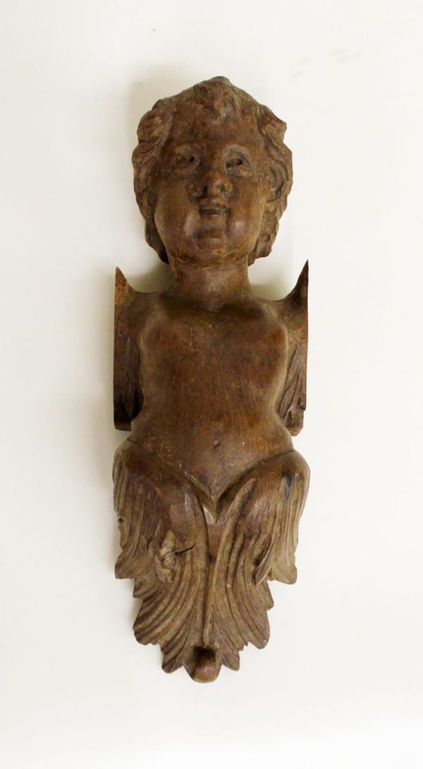 Cariatide, sec. XVIII, in noce scolpito a motivo busto di putto desinente&nbsp;