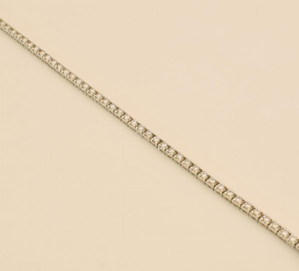 BRACCIALETTO TENNIS IN ORO BIANCO E DIAMANTI                                - Asta Gioielli, Arredi d'antiquariato, Dipinti dal XVI al XX Secolo e Argenti - Poggio Bracciolini Casa d'Aste