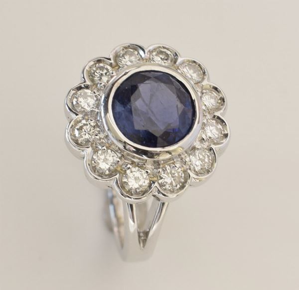 ANELLO A MARGHERITA CON ZAFFIRO BIRMANO E DIAMANTI                        