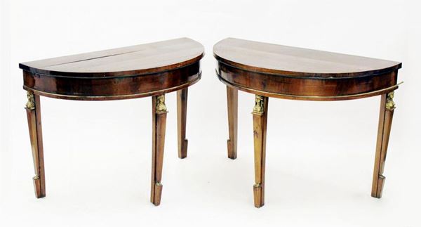 Coppia di console, sec. XIX, rapporti in metallo dorato, cm 122,5x56x81, difetti (2)                     