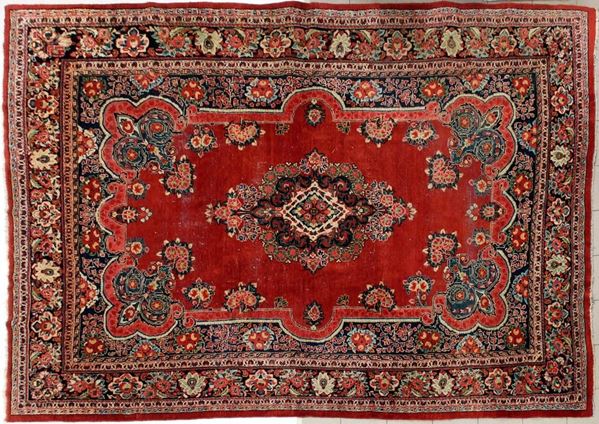 Tappeto persiano, sec. XX, impianto floreale, campo rosso centrato da&nbsp;&nbsp;&nbsp;&nbsp;&nbsp;