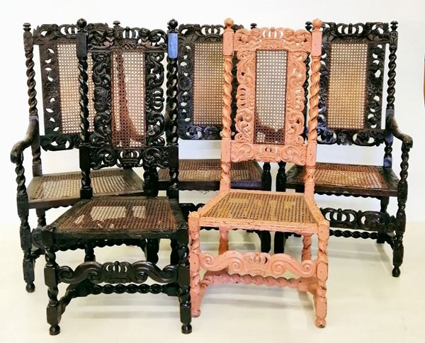 



Quattro poltrone e quattro sedie, sec. XIX, in rovere intagliato,
