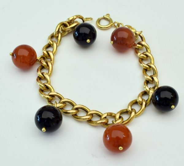 



BRACCIALE IN ORO KT18 E PIETRE