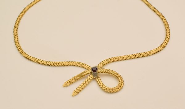 



COLLANA GIROCOLLO IN ORO GIALLO , ORO BIANCO KT18 E GRANATO