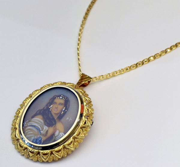 



SPILLA PENDENTE IN ORO 18KT CON MINIATURA