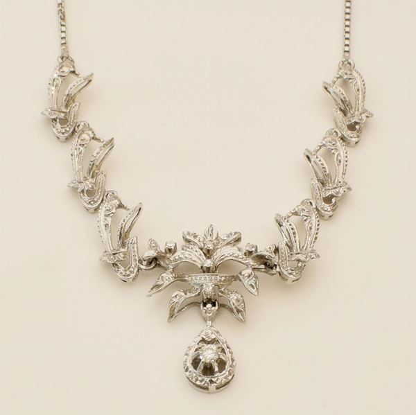 



COLLANA GIROCOLLO IN ORO BIANCO 18KT E DIAMANTI