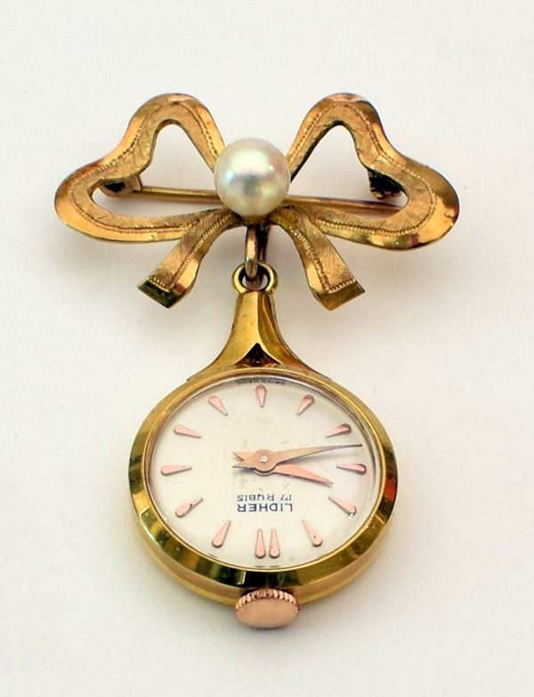 



SPILLA CON OROLOGIO LIDHER IN ORO GIALLO 18 KT