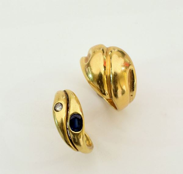 



DUE ANELLI IN ORO 18KT , DIAMANTI E RUBINO