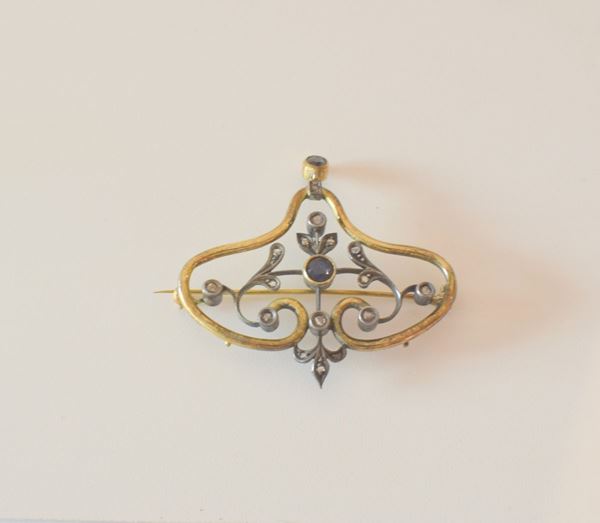 



SPILLA IN ORO 18KT , ARGENTO,&nbsp; DIAMANTI E ZAFFIRI