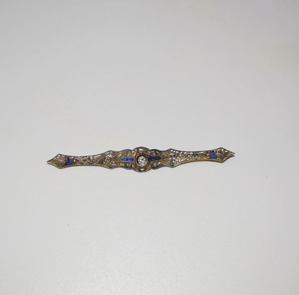 



SPILLA IN ORO A BASSO TITOLO , DIAMANTE E ZAFFIRI