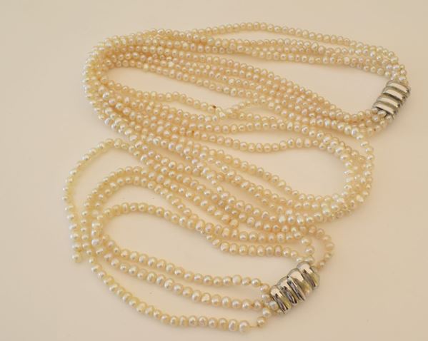 



COLLANA E BRACCIALE IN ORO 18KT E PERLE