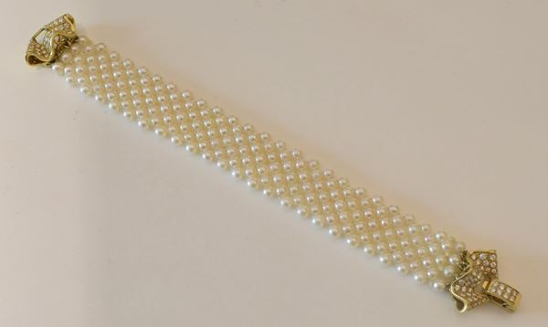 BRACCIALE IN ORO 18KT, DIAMANTI E PERLE