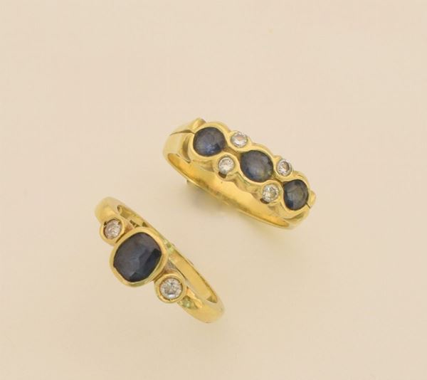 



DUE ANELLI IN ORO GIALLO 18KT DIAMANTI E ZAFFIRI
