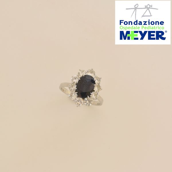 ANELLO A MARGHERITA IN ORO BIANCI 18KT , DIAMANTI E ZAFFIRO