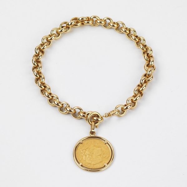 



BRACCIALE IN ORO 18KT E PENDENTE CON MONETA 10 FRANCHI