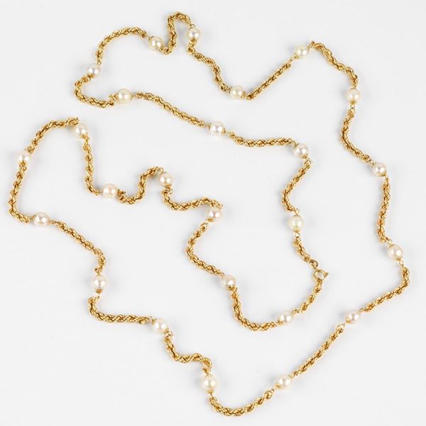 



LUNGA COLLANA IN ORO 18KT E PERLE