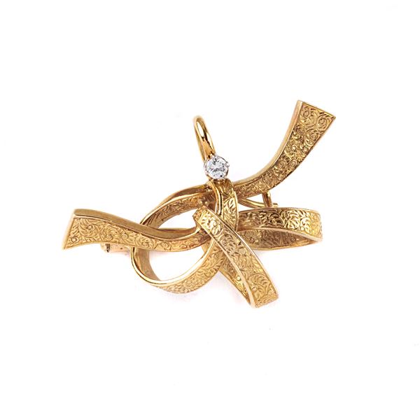 



SPILLA IN ORO GIALLO 18KT E DIAMANTE