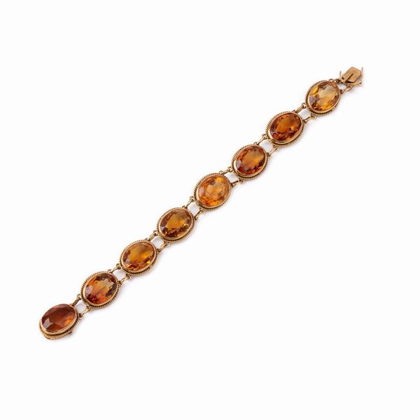 



BRACCIALE IN ORO GIALLO 18KT E TOPAZI