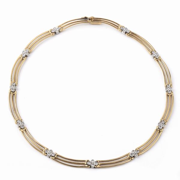 



COLLANA GIROCOLLO IN ORO 18KT E DIAMANTI