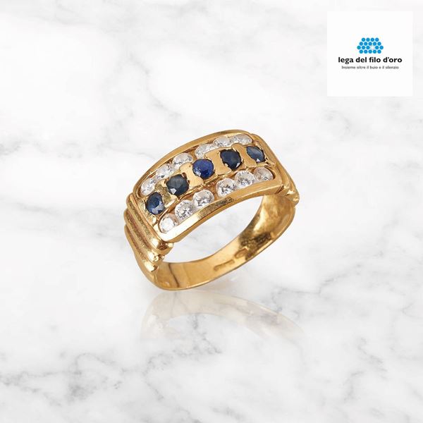 



ANELLO IN ORO GIALLO 18KT E PIETRE