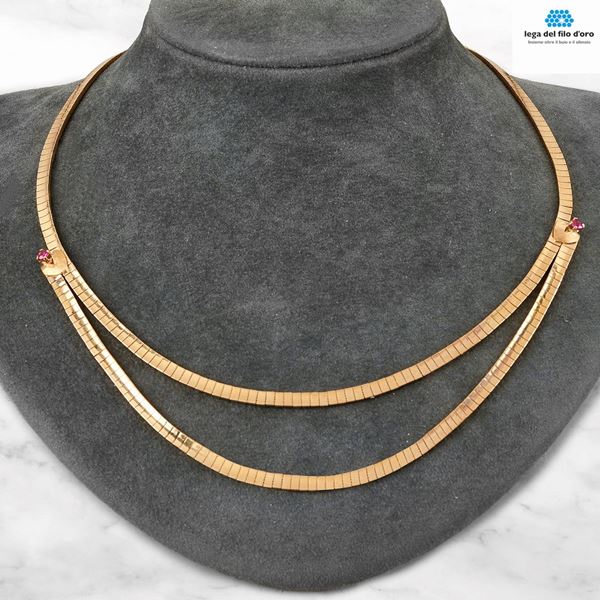



COLLANA GIROCOLLO IN ORO 18KT E RUBINI