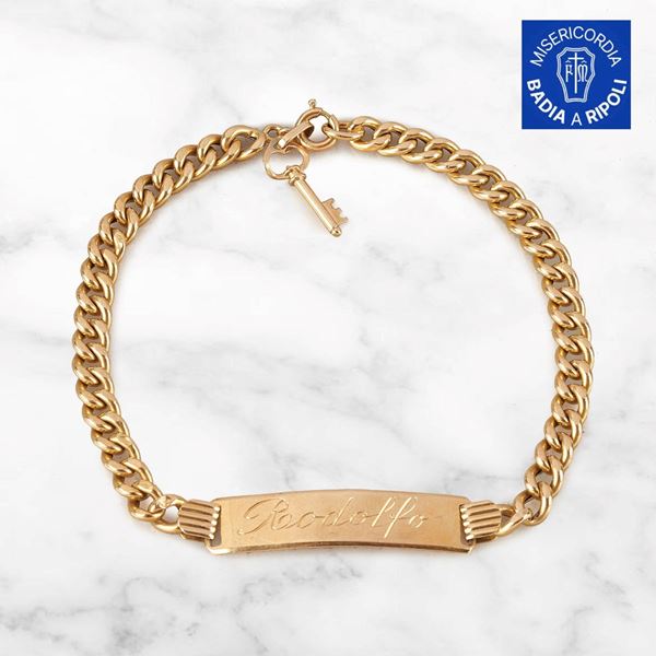 



BRACCIALE CON PIASTRINA IN ORO GIALLO 18KT