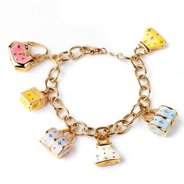 



BRACCIALE IN ORO GIALLO 18 KT E CHARMS