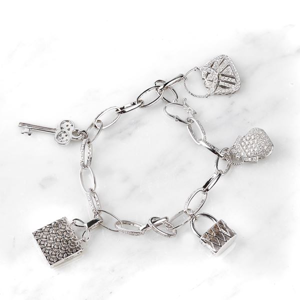 



BRACCIALE IN ORO BIANCO 18 KT, CHARMS E PIETRE  - Asta Gioielli e Preziosi - Poggio Bracciolini Casa d'Aste