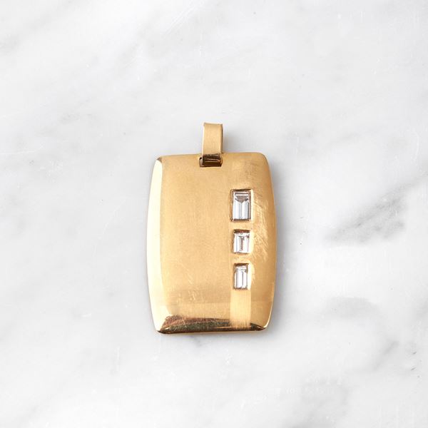 



MEDAGLIA IN ORO GIALLO 18KT E DIAMANTI