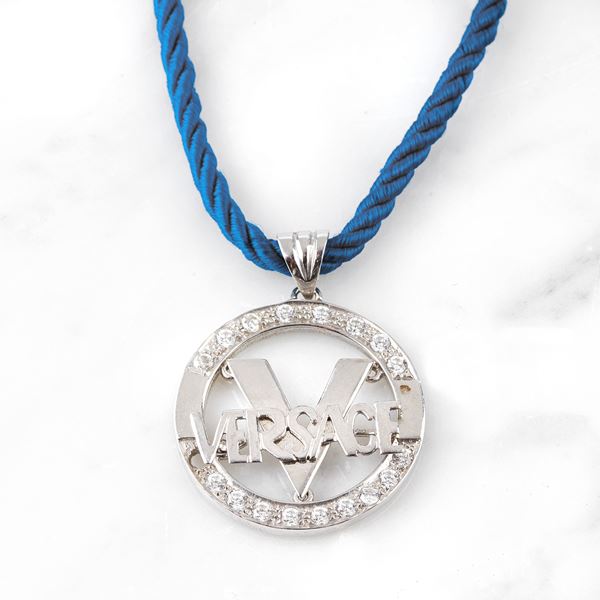 



PENDENTE IN ORO 18KT E PIETRE