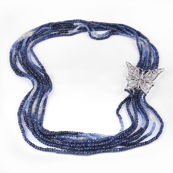 



COLLANA A SETTE FILI IN RADICI DI PIETRE PREZIOSE