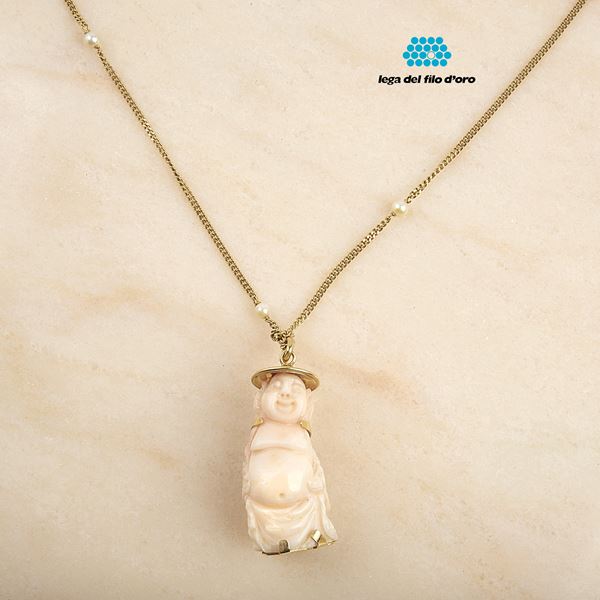



COLLANA IN ORO GIALLO 18KT E PENDENTE IN CORALLO ROSA
