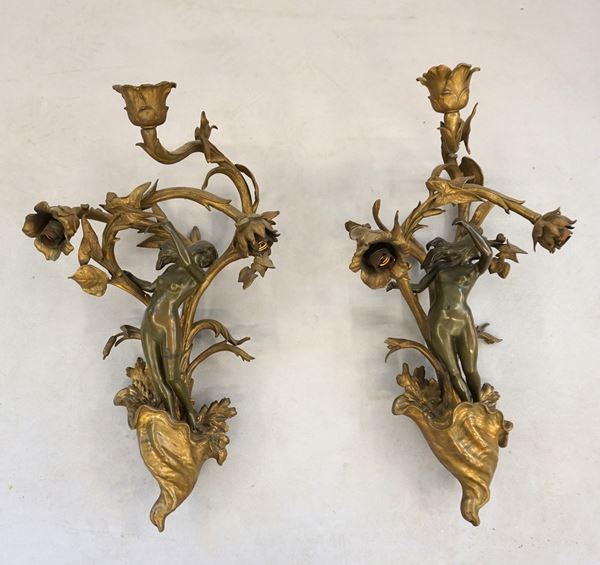 



Coppia di grandi appliques, inizi sec. XX  - Asta Arredi, mobili e oggetti d'arte - Poggio Bracciolini Casa d'Aste