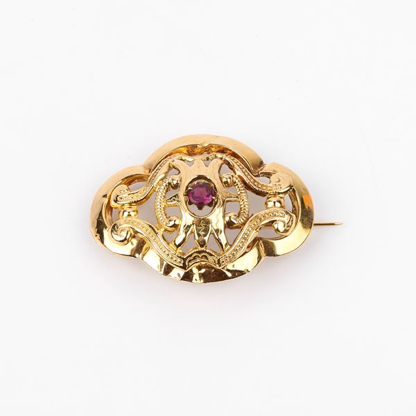 



SPILLA IN ORO GIALLO 18KT E PIETRA