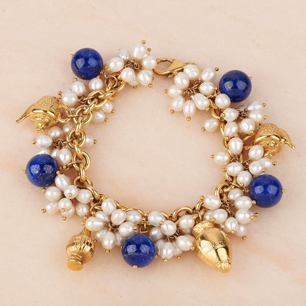 



BRACCIALE IN ORO GIALLO 18KT, PERLE, PIETRE E CHARMS