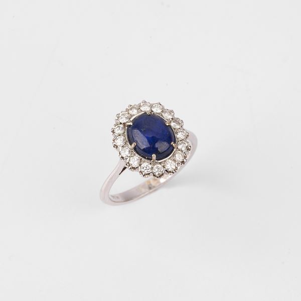 



ANELLO A MARGHERITA IN ORO BIANCO 18 KT, DIAMANTI E ZAFFIRO