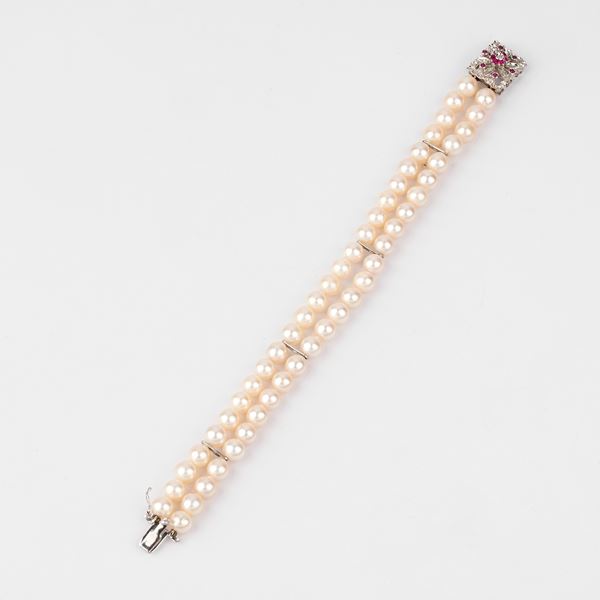 



BRACCIALE IN ORO BIANCO 18 KT, RUBINI E PERLE